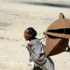 A Tigray woman walks to the market to sell table covers in Mekele March 12, 2007.